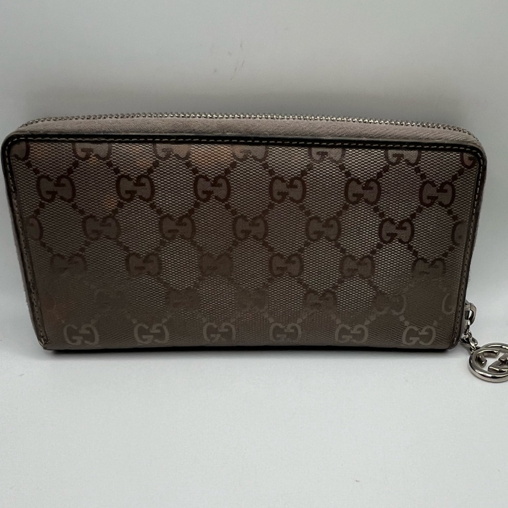 Vintage Gucci wallet. With a Gucci charm.